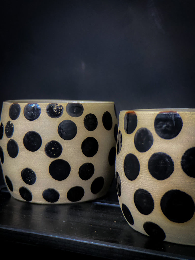 Big coffee mug with big black shiny dots